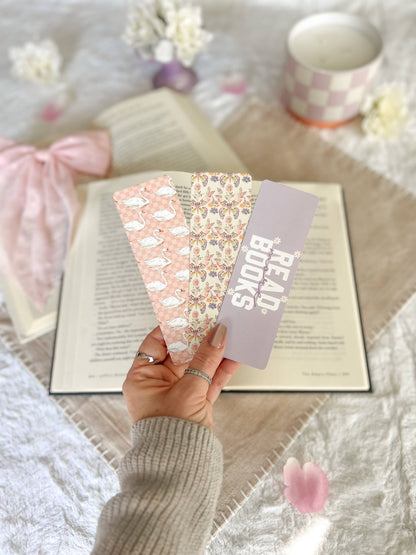 Swans, butterfly and read books Bookmarks
